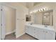 Bright bathroom with dual sinks, expansive mirror and neutral paint at 2417 Chestnut Hill St, Las Vegas, NV 89134