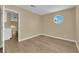 Neutral bedroom with light-tone floors and round window at 2417 Chestnut Hill St, Las Vegas, NV 89134