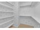 Walk-in closet with shelves and hanging rods for optimal organization at 2417 Chestnut Hill St, Las Vegas, NV 89134