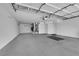 A clean and spacious three-car garage with ample lighting and storage capabilities at 2417 Chestnut Hill St, Las Vegas, NV 89134