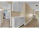Hallway with wood floors and white cabinets at 2417 Chestnut Hill St, Las Vegas, NV 89134