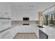 Bright kitchen featuring white cabinets, stainless steel appliances and ample counter space at 2417 Chestnut Hill St, Las Vegas, NV 89134