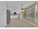 Modern kitchen with stainless steel appliances, sleek white cabinets and a marble countertop at 2417 Chestnut Hill St, Las Vegas, NV 89134