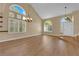 Bright living room featuring hardwood floors, high ceilings, and lots of natural light from large windows at 2417 Chestnut Hill St, Las Vegas, NV 89134