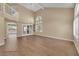 Bright living room showcasing tall ceilings, hardwood floors, and windows with plantation shutters at 2417 Chestnut Hill St, Las Vegas, NV 89134
