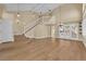 Bright living room showcasing stairs, hardwood floors, and large windows for natural light at 2417 Chestnut Hill St, Las Vegas, NV 89134