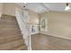 Bright living room with staircase, wood floors, large windows, and neutral paint at 2417 Chestnut Hill St, Las Vegas, NV 89134
