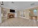 Spacious living room features a cozy brick fireplace and access to additional living spaces at 2417 Chestnut Hill St, Las Vegas, NV 89134