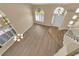 Open-plan living room with wood floors, a staircase, lots of windows and natural light at 2417 Chestnut Hill St, Las Vegas, NV 89134