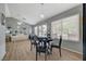 Open-concept dining area with a chandelier, seamlessly connected to the living room and outdoor patio at 2430 Sungold Dr, Las Vegas, NV 89134