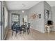 Dining area showcasing a dark table and access to both the living area and hallway at 2430 Sungold Dr, Las Vegas, NV 89134