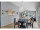 Bright dining area with a modern chandelier and access to the living room and backyard at 2430 Sungold Dr, Las Vegas, NV 89134