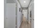 This hallway has laminate floors and decor on the walls at 2430 Sungold Dr, Las Vegas, NV 89134