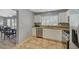 Well-lit kitchen featuring stainless steel appliances, tile floors, granite countertops, and ample cabinet space at 2430 Sungold Dr, Las Vegas, NV 89134