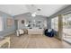 Bright living room with wood floors, neutral walls, and a glass slider leading to the patio at 2430 Sungold Dr, Las Vegas, NV 89134
