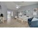 Comfortable living room with wood floors, a vaulted ceiling, and an abundance of natural light at 2430 Sungold Dr, Las Vegas, NV 89134