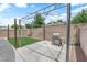 Backyard featuring a grass patch, a metal pergola, and a barbecue grill at 2432 Shady Hill Ave, Las Vegas, NV 89106