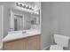 Bathroom featuring vanity, sink, framed mirror, and toilet at 2432 Shady Hill Ave, Las Vegas, NV 89106