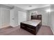 Bedroom with platform bed, carpet floors, and sliding door closet at 2432 Shady Hill Ave, Las Vegas, NV 89106