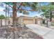 Front exterior shot showcasing the lawn and garage at 2432 Shady Hill Ave, Las Vegas, NV 89106