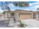 Home's exterior with a front-facing two car garage at 2432 Shady Hill Ave, Las Vegas, NV 89106