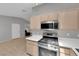 Bright kitchen featuring stainless steel appliances, gas range, and ample counter space at 2432 Shady Hill Ave, Las Vegas, NV 89106