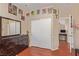 A well-lit bedroom with a closet and decorated with superhero artwork and a large dinosaur dresser at 2621 Rainbow Glow St, North Las Vegas, NV 89030