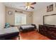 Bright bedroom featuring two twin beds, themed decor, and hardwood floors, perfect for a  at 2621 Rainbow Glow St, North Las Vegas, NV 89030