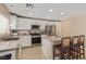 Well-lit kitchen featuring stainless steel appliances and a center island at 2621 Rainbow Glow St, North Las Vegas, NV 89030