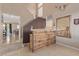 Bright foyer with tile floors, a staircase, and a bar area for entertaining at 2621 Rainbow Glow St, North Las Vegas, NV 89030