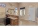 Bright foyer with tile floors, a staircase, and a bar area for entertaining at 2621 Rainbow Glow St, North Las Vegas, NV 89030