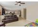 Open-concept living area with tile flooring connecting to the kitchen at 2621 Rainbow Glow St, North Las Vegas, NV 89030