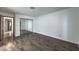 Spacious bedroom featuring wood floors and a large closet with mirrored doors at 2761 Carnation Ln # 1, Henderson, NV 89074