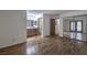 Spacious bedroom boasts wood floors, a bathroom with granite countertop, and mirrored closet doors at 2761 Carnation Ln # 1, Henderson, NV 89074