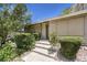 Inviting front entrance with a well-maintained walkway and beautiful, mature shrubbery at 2761 Carnation Ln # 1, Henderson, NV 89074