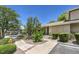 Inviting front entrance with lush landscaping and a covered parking area, perfect for easy access at 2761 Carnation Ln # 1, Henderson, NV 89074