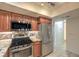 Updated kitchen featuring stainless steel appliances, tiled backsplash, and granite countertops at 2761 Carnation Ln # 1, Henderson, NV 89074