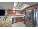 Open kitchen featuring stainless steel appliances, granite countertops, and tile floors at 2761 Carnation Ln # 1, Henderson, NV 89074