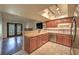Well lit kitchen featuring granite counters, stainless steel appliances, and abundant storage space at 2761 Carnation Ln # 1, Henderson, NV 89074