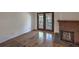 Living room featuring laminate floors and brick fireplace at 2761 Carnation Ln # 1, Henderson, NV 89074
