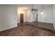 Large living area boasting wood floors, modern lighting, neutral walls, and a split-level layout at 2761 Carnation Ln # 1, Henderson, NV 89074