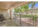 View from the shaded patio overlooking a well-maintained lawn with mature trees at 2761 Carnation Ln # 1, Henderson, NV 89074