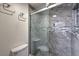 Bathroom featuring a glass shower with custom tile and built-in seat at 2761 Carnation Ln # 1, Henderson, NV 89074