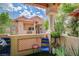 Relaxing balcony with patio furniture and lush green surroundings at 2925 Wigwam Pkwy # 123, Henderson, NV 89074