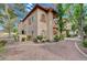 Charming two-story condo exterior featuring well-maintained landscaping and a welcoming facade at 2925 Wigwam Pkwy # 123, Henderson, NV 89074