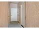 Hallway with doors and neutral walls, offering a sense of privacy and entry points at 2925 Wigwam Pkwy # 123, Henderson, NV 89074