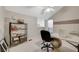 Home office area featuring a white desk, comfortable chair, and ample storage at 2925 Wigwam Pkwy # 123, Henderson, NV 89074