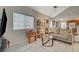 Open-concept living room with lots of natural light, seamlessly connecting to the kitchen at 2925 Wigwam Pkwy # 123, Henderson, NV 89074