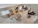 Open-concept living room with a fireplace and tile and wood floors, seen from above at 2925 Wigwam Pkwy # 123, Henderson, NV 89074