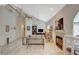 Spacious living room with high ceilings, fireplace, and ample natural light at 2925 Wigwam Pkwy # 123, Henderson, NV 89074